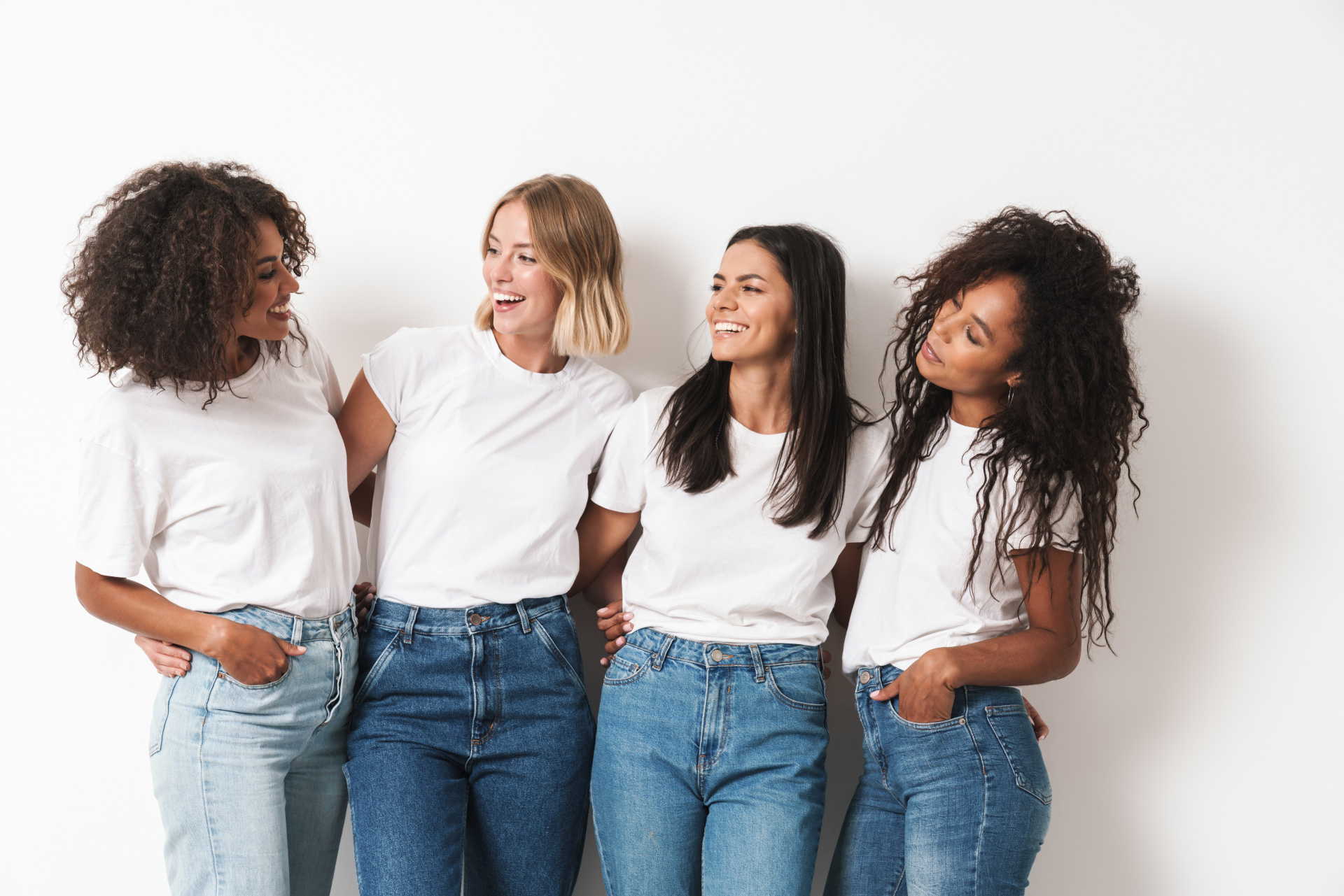 Optimistic cheery young women multiracial friends