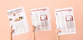 Female hands with newspapers on color background