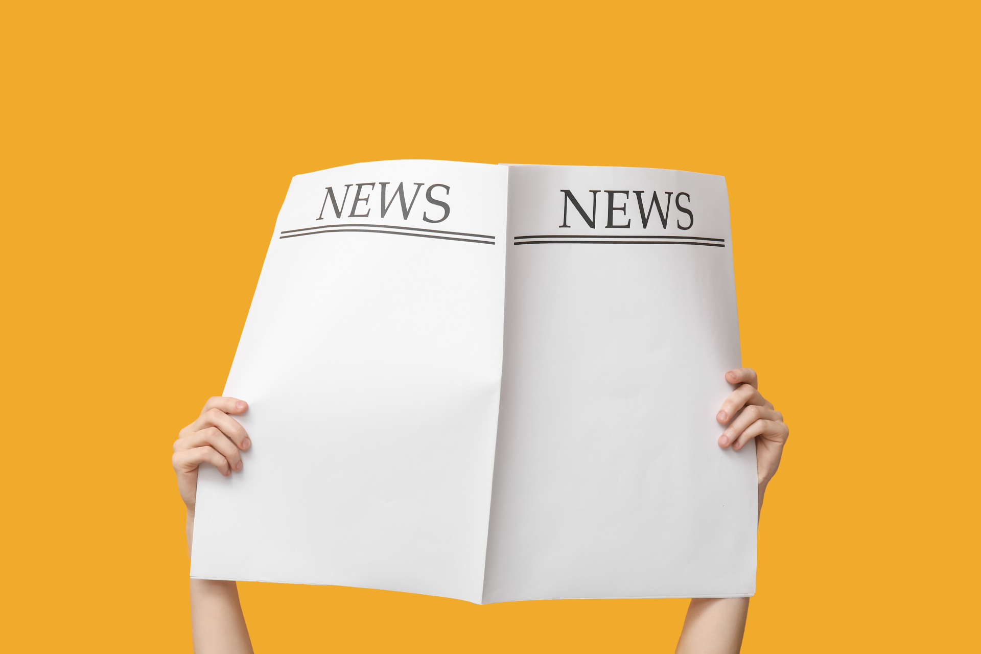 Woman with blank newspapers on yellow background