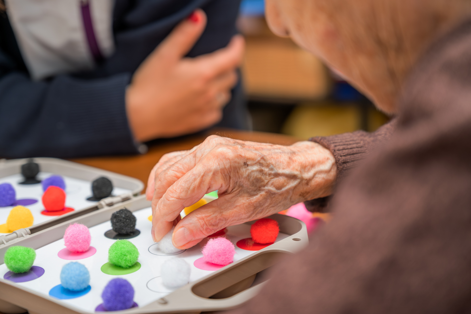 Rehabilitation center. Brain therapy cognitive psychological testing on senior patient. Alzheimer's disease and dementia prevention concept. Adaptation skills recovery Rehabilitation center. Brain therapy cognitive psychological testing on senior patient. Alzheimer's disease and dementia prevention concept. Adaptation skills recovery