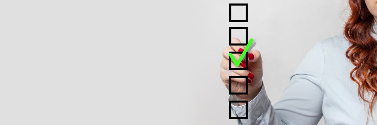 Kästchen mit einem grünen erledigt Häckchen