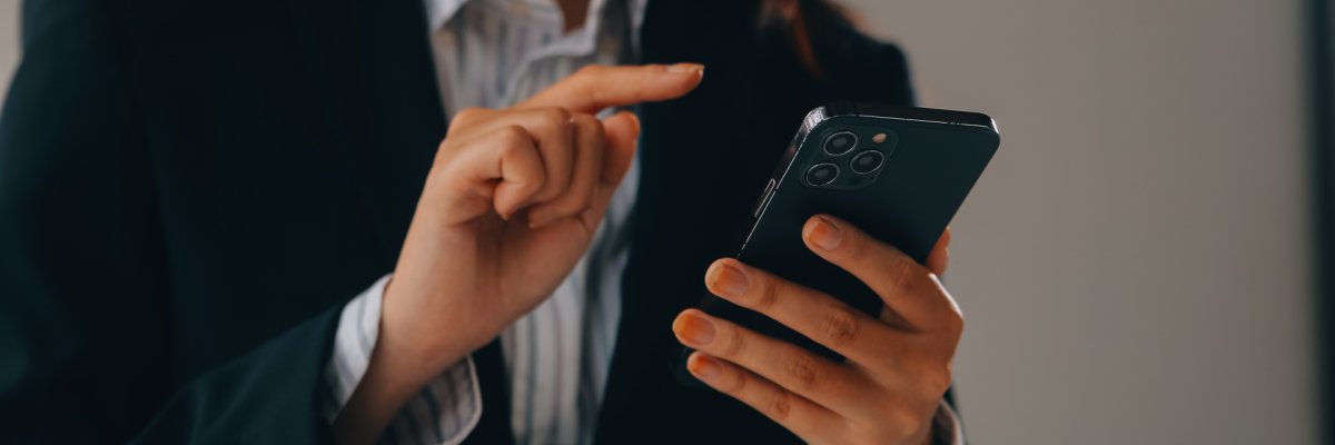 Communication support, call center and customer service help desk. VOIP headset on telephone keyboard.