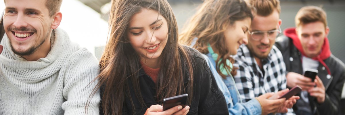 Close of a young people who use mobile phone