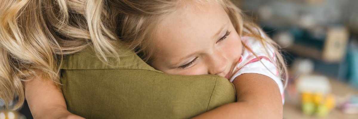 Warmth of loving mothers embrace stock photo