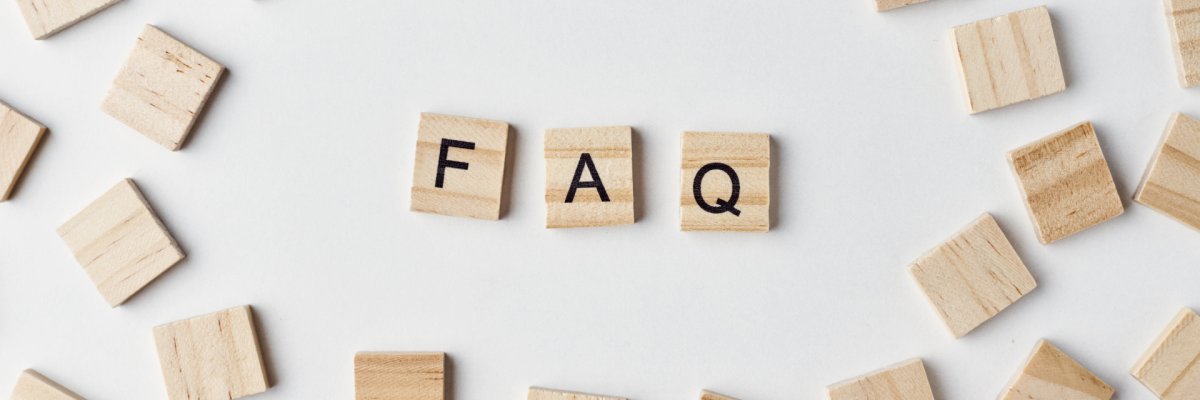 Wooden blocks with abbreviation FAQ on the white background, top