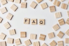 Wooden blocks with abbreviation FAQ on the white background, top